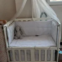 تخت کنار مادر کودک