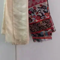 تعدادی شال و روسری و لباس زنانه