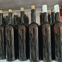 بطری شیشه ای قهوه ای با درب چوب پنبه و کاپ حرارتی