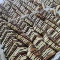 شیرینی سه گوش تی تابی قیمت ۴۵۰تومن هرکیلو