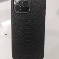 طرح آیفون 15 پرومکس مشکی با قاب چرم و قسطی