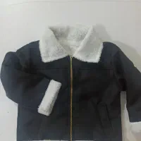 خیاط بیرونبر کاپشن