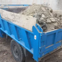 نیسان کمپرسی و تراکتور بیلدار حمل نخاله