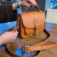 کیف وکمربند چرمی دست دوز و حکاکی شده