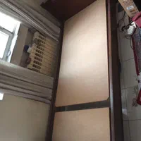 تخت خواب چوبی یکنفره کشو دار.