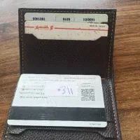 کیف کارت بانکی با مدارک همراه مقداری چک و وجه نقد
