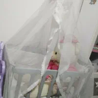 گهواره کنار تخت مادر