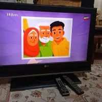 تلویزیون LG همراه با میز شیشه ای و گیرنده دیجیتال