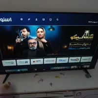 تلویزون اسنوا هوشمند ۴۳ اینچ و میز تلویزیون