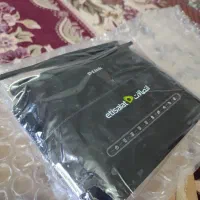 مودم دلینک و اسپیکر جیبی با کارتن و وسایل