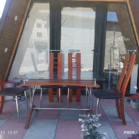 میز ناهارخوری 8نفره چوب وشیشه وفلز نشیمن چرم