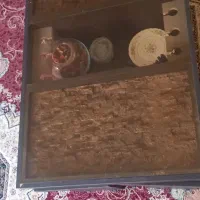 میز وسط بوفه شیشه ای ساعت