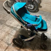 کالسکه کودک و میز ناهار خوری کودک