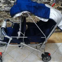 کالسکه دوقلو بچه سورمه ای رنگ