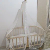 گهوار تخت کنار مادر