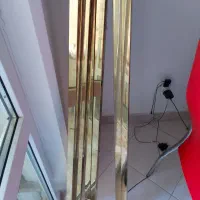 چند عدد شاخه استیل طلایی برای قفسه بندی مغازه