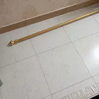 میل پرده پانچی طلایی رنگ