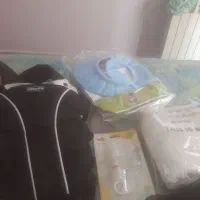 وسایل بچه  شامل آغوشی وحوله حمام وکلاه حمام وغیره