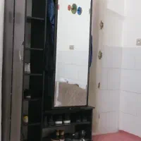 جاکفشی با آیینه قدی