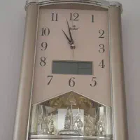 ساعت دیواری طلایی شماطه دار و زنگ خور