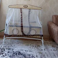 گهواره به همراه پشه بند