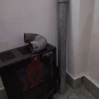 بخاری گازی کوچیک در حده نو همراه با لوله زانو