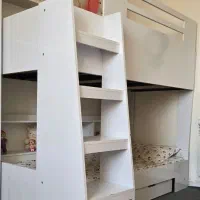 تخت دوطبقه کودک و نوجوان MDF قفسه‌دار و کشودار