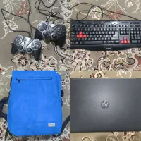 لپ‌تاپ hp به همراه وسایل جانبی