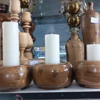 شمعدان های چوبی در طرح و سایز متفاوت