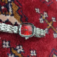 ساعت زرشکی آبنباتی