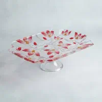 دیس پایه دار شیشه ای زیبا با گل های قرمز