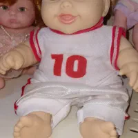 عروسک|اسباب‌بازی بچه|قم, باغ شریفی|دیوار