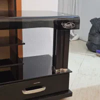 میز تلویزیون لوکس آنتالیا - شیشه خم تمپرد در حد نو|میز تلویزیون|رویان, |دیوار