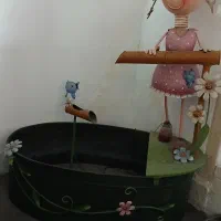 عروسک چینی و آب نما