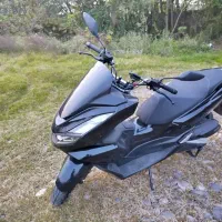 یک دستگاه موتور پی سی ایکس مدل 1403مسگی پیانویی