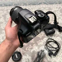 دوربین Canon 1300 D + یک لنز اضافه