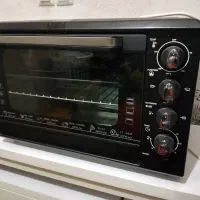 1توستر طرح فر آکبند و1میز تلویزیون نو