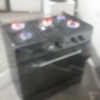 ماشین لباسشویی میلاد واجاق گاز طرح ۵شعله