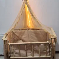 گهواره و تخت کنار مادر تاشو