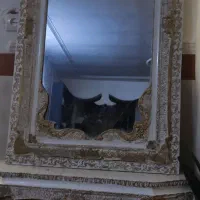 آیینه و شمعدان وساعت