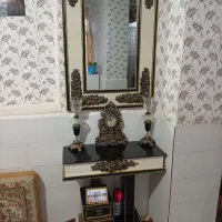 اینه و شمعدان با ساعت