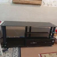 زیر تلویزیونی دو عدد شیشه ای و چوبی در حد نو