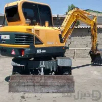 مینی بیل مکانیکی به همراه پیکور