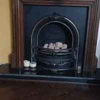 شومینه چدنی با قاب درخت گردو بسار شیک و کلاسیک