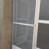 ساخت وتعمیرات انواع درب پنجره توری آلمینیوم وPVC