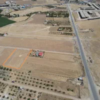 زمین1000متری روی جاده بوگه بسی،ژینگه پاریز