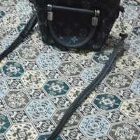 کیف دوشی|کیف، کفش، کمربند|رشت, فلسطین|دیوار