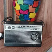 رادیو قدیمی کوزه  قالی قدیمی دستگاه سی دی سامسونگ