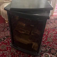 میز تلویزیون شیشه دودی دو طبقه با پایه گردان
