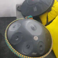 هنگ درام ارشا نو با کیف و بافت دور و یک ساز کوزه